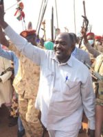 Members of the Sudanese coalition Forces kill a man in west Darfur